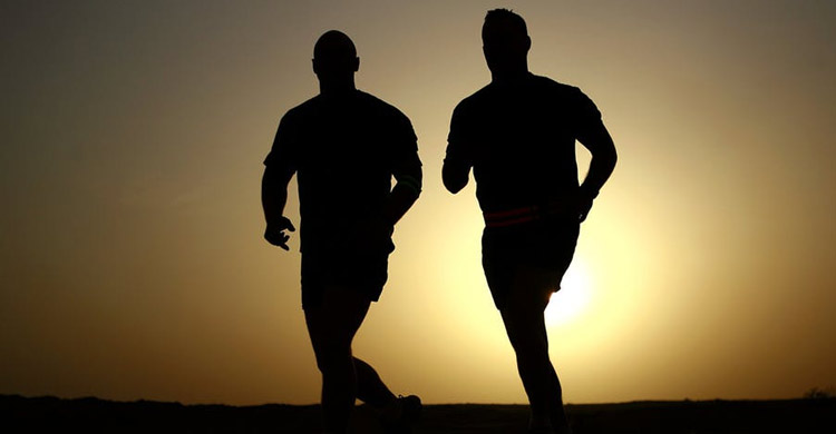 Men Running in the Sunset.